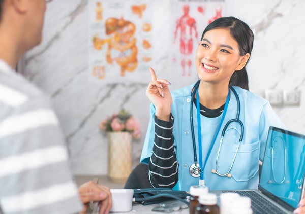 Medicine and health care concept. Asian woman doctor is taking