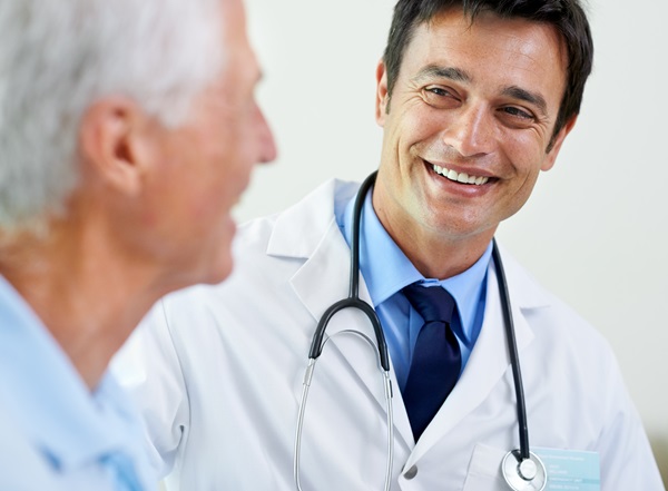 doctor smiling with men patient