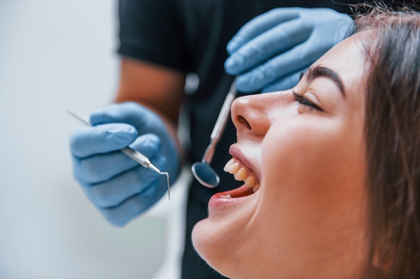 young adult woman that have a visit in the dentist clinic