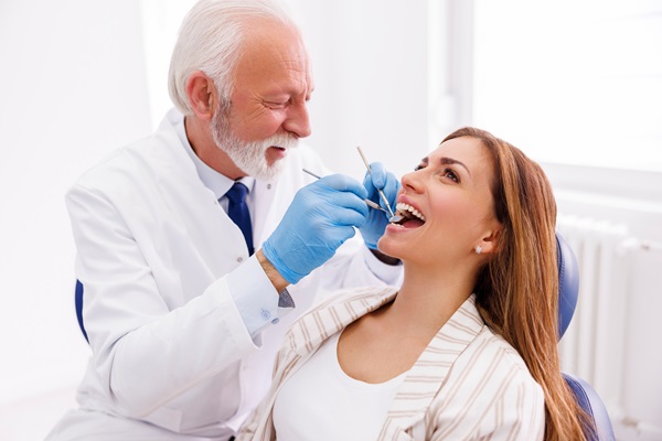 Doctor checking up patient at dentist office